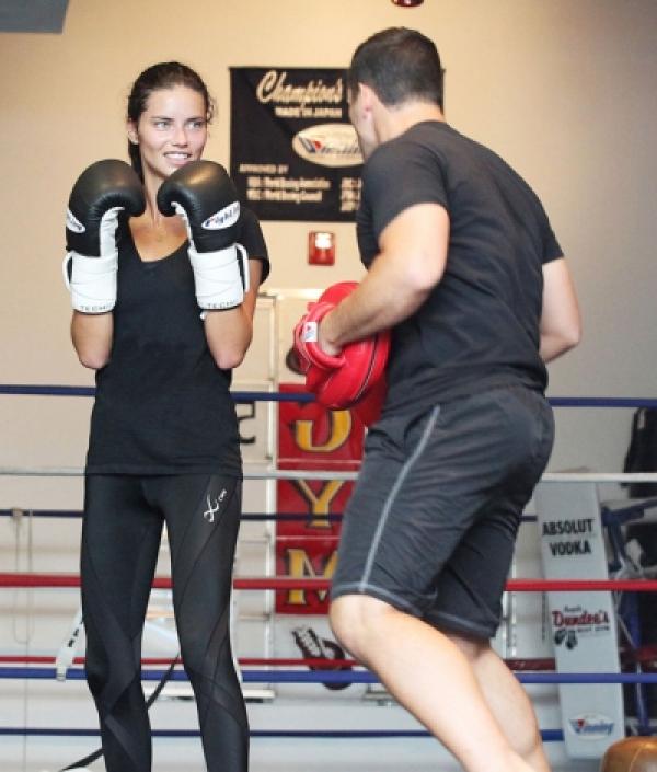 Adriana Lima hits the gym with her trainer for boxing