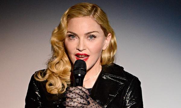 Madonna regrets kissing Drake
