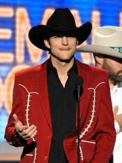 Ashton Kutcher dances like a cowboy at the Country Music Festival